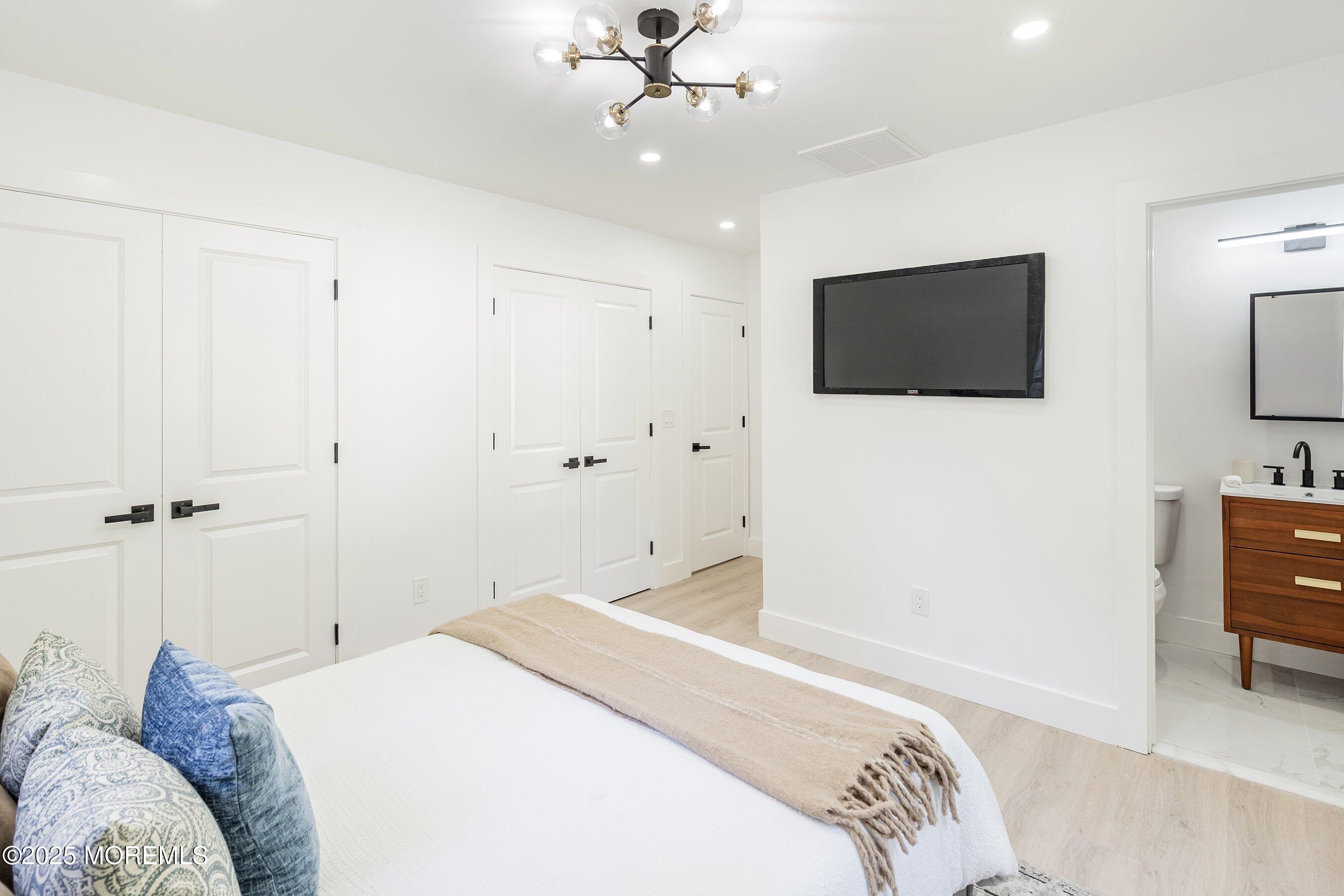 11 Malsbury Lane Cream Ridge, NJ 08514 - Photo 10 of 17 a bedroom with a bed and a flat screen tv