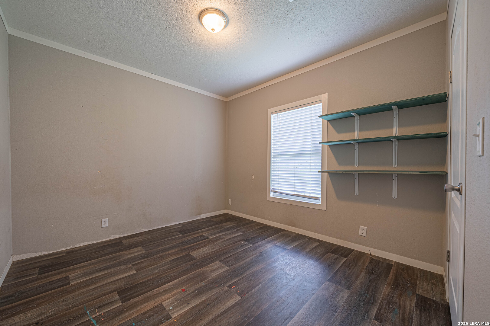 3433 Gander Slough Road Kingsbury, TX 78638 - Photo 18 of 23 a view of a room with wooden floor and windows