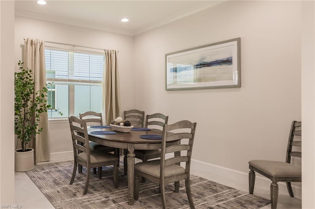 7263 Cayo Coco Lane Naples, FL 34113 - Photo 19 of 44 a view of a dining room with furniture