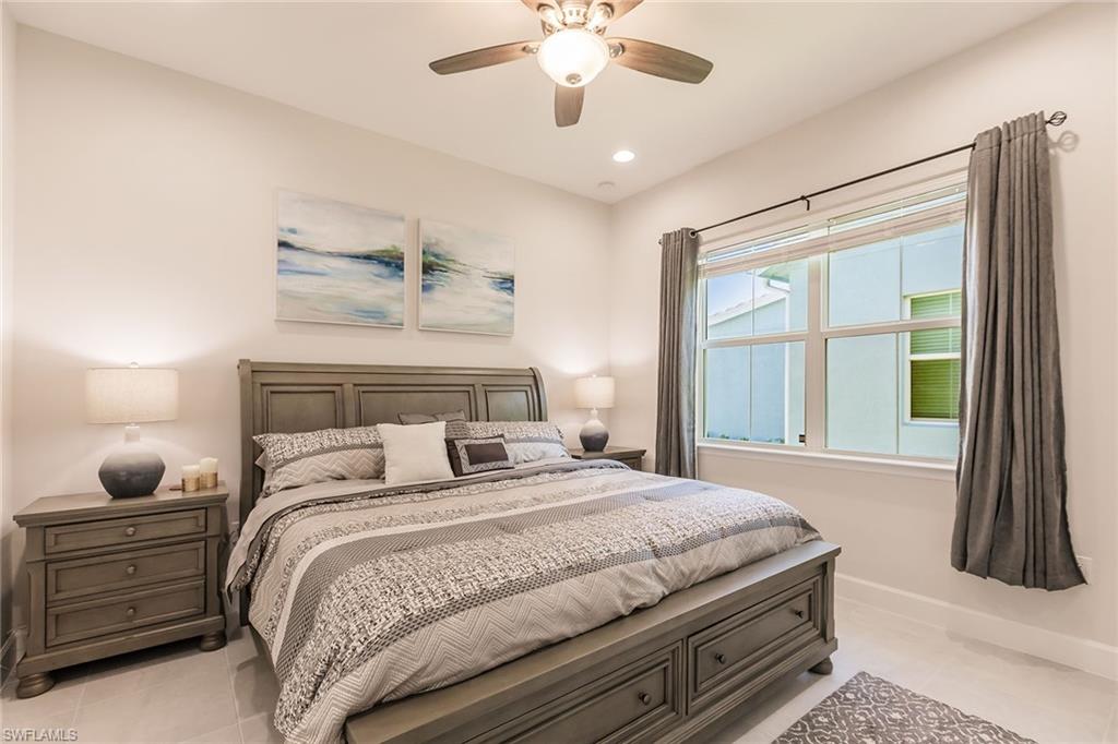 7263 Cayo Coco Lane Naples, FL 34113 - Photo 22 of 44 a bedroom with a bed and window