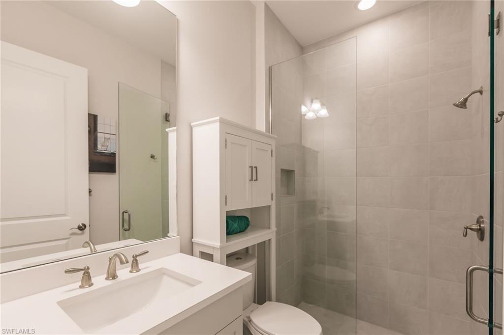 7263 Cayo Coco Lane Naples, FL 34113 - Photo 29 of 44 a bathroom with a sink toilet and shower
