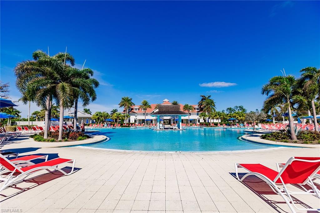 7263 Cayo Coco Lane Naples, FL 34113 - Photo 35 of 44 a view of swimming pool with outdoor seating