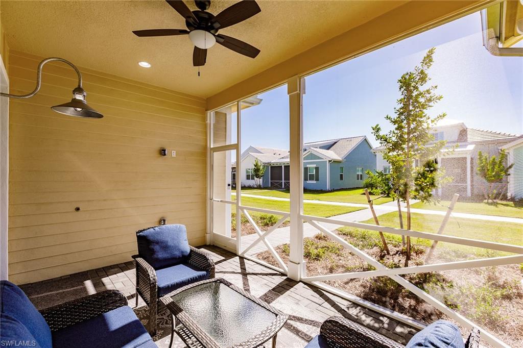 7263 Cayo Coco Lane Naples, FL 34113 - Photo 9 of 44 a view of a livingroom with furniture and a ceiling fan