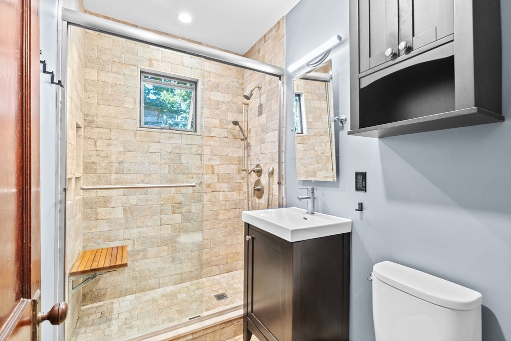 25 Whitby Terrace, Unit 3 Boston, MA 02125 - Photo 22 of 35 a bathroom with a sink a toilet and shower