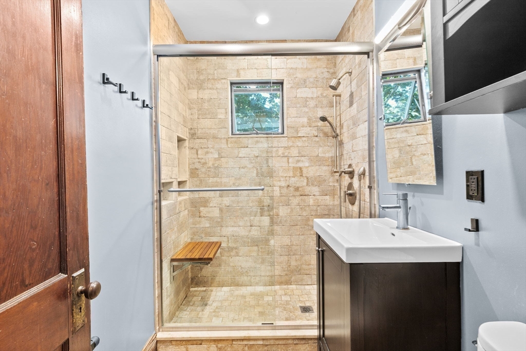 25 Whitby Terrace, Unit 3 Boston, MA 02125 - Photo 23 of 35 a bathroom with a sink and a mirror
