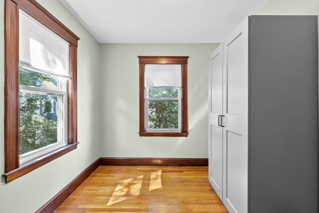 25 Whitby Terrace, Unit 3 Boston, MA 02125 - Photo 26 of 35 a view of an empty room with a window and a mirror