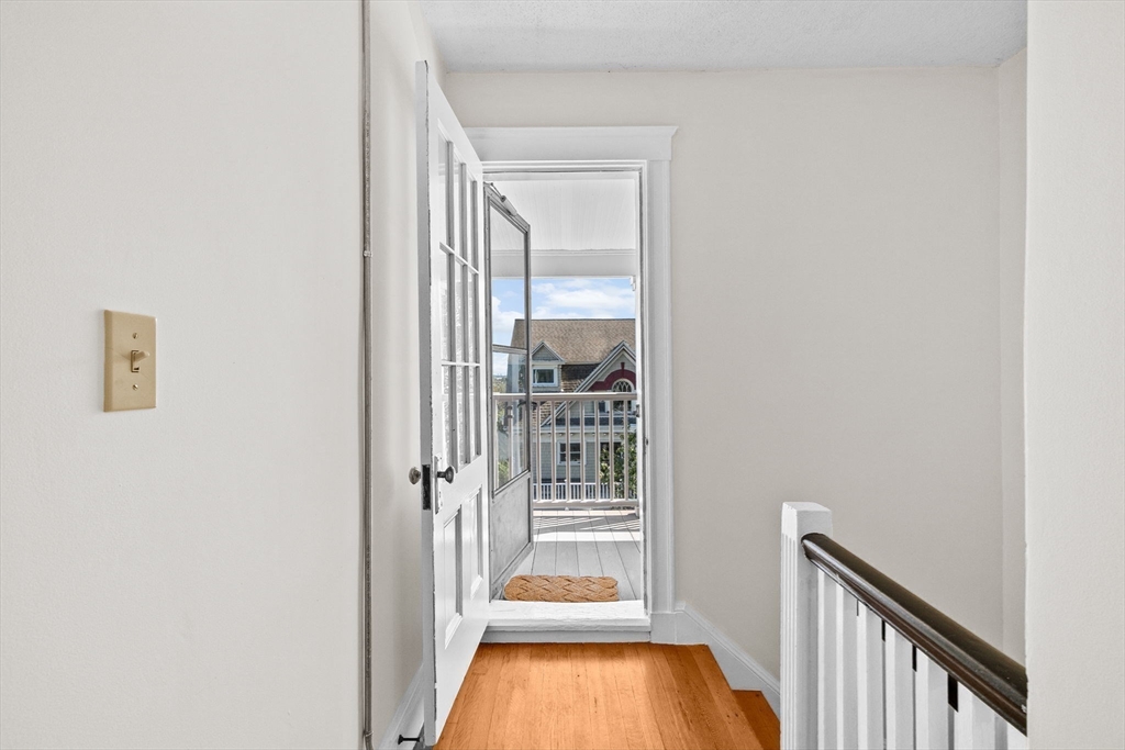 25 Whitby Terrace, Unit 3 Boston, MA 02125 - Photo 27 of 35 a view of a hallway with wooden floor and a floor to ceiling window
