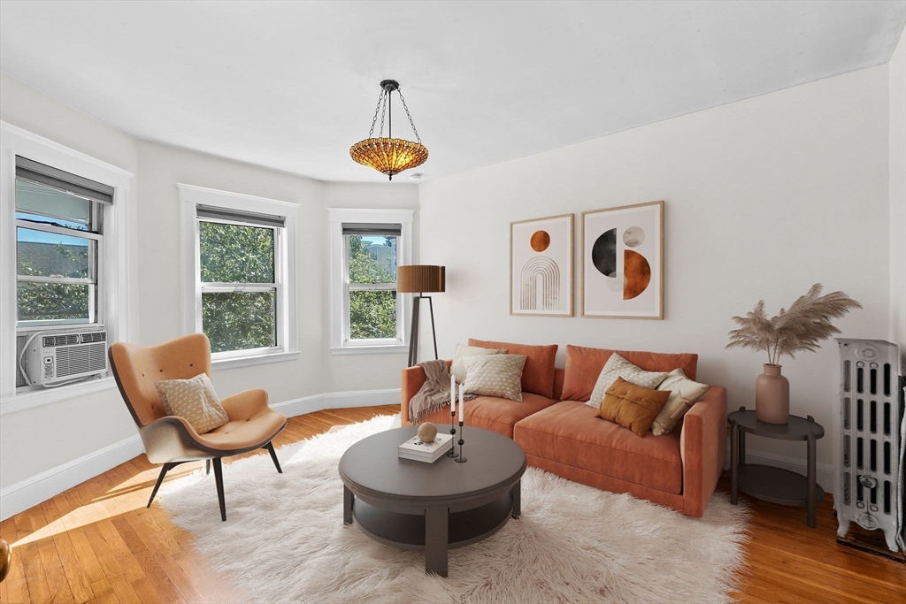 25 Whitby Terrace, Unit 3 Boston, MA 02125 - Photo 3 of 35 a living room with furniture and a large window