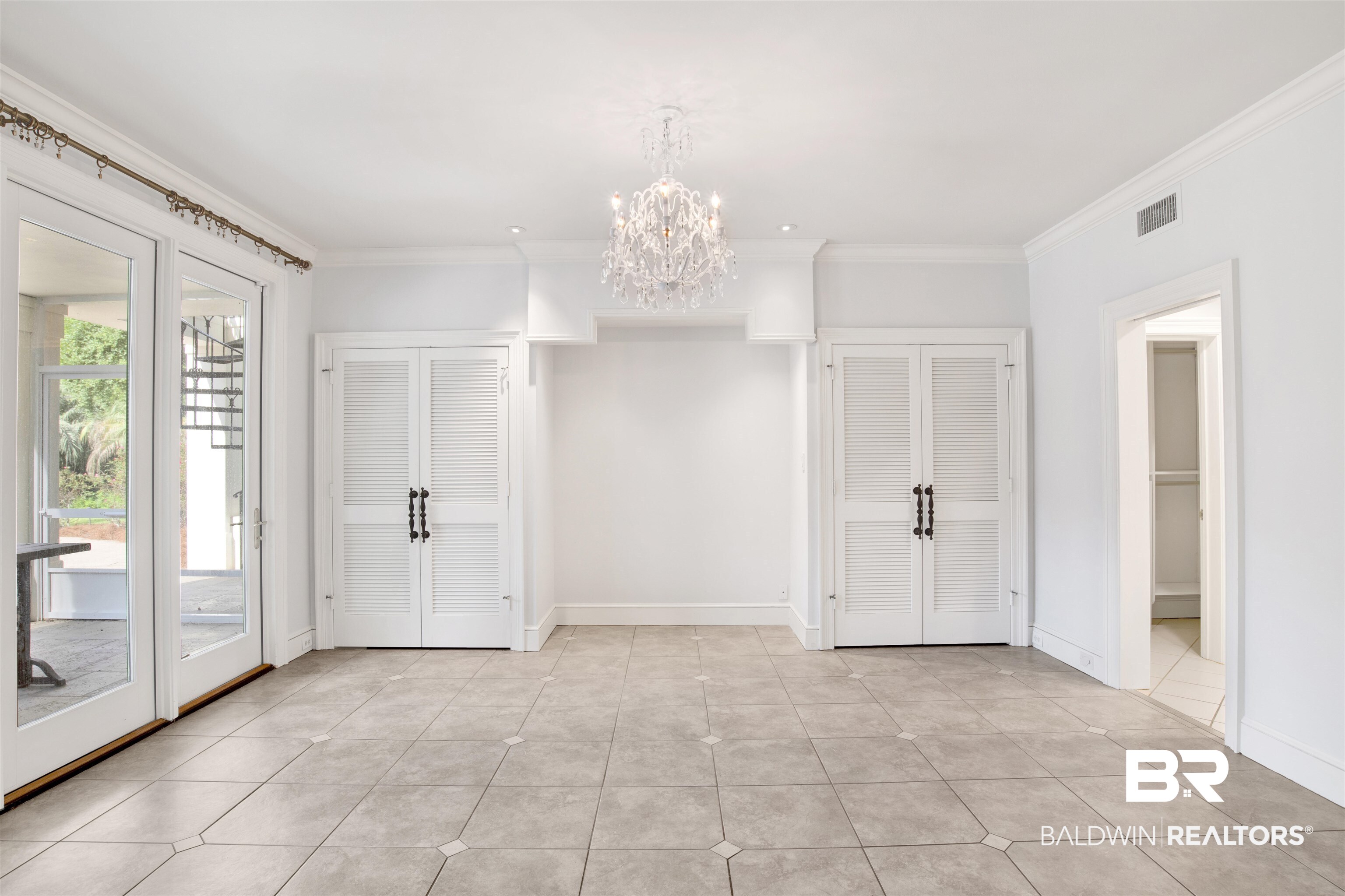 3816 Austill Lane Mobile, AL 36608 - Photo 51 of 80 Entrance foyer with a chandelier, crown molding, and light tile patterned floors