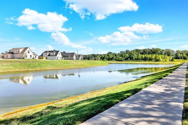 a view of a lake with a big yard