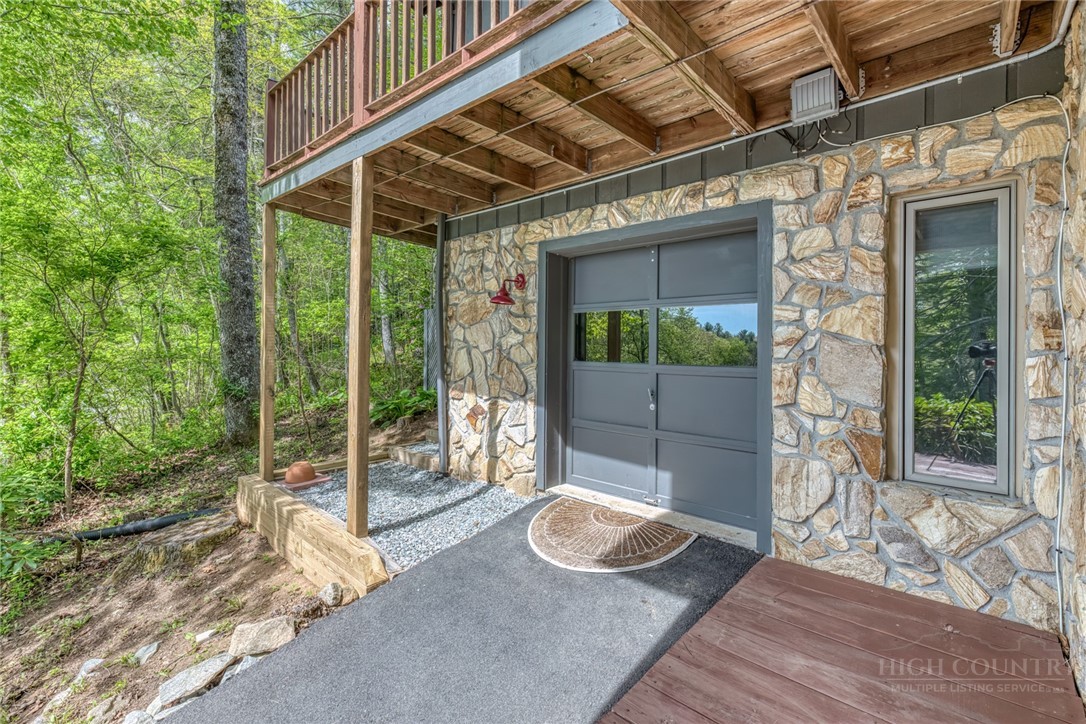 174 Spruce Pine Road Newland, NC 28657 - Photo 37 of 50 a view of a house with backyard and porch