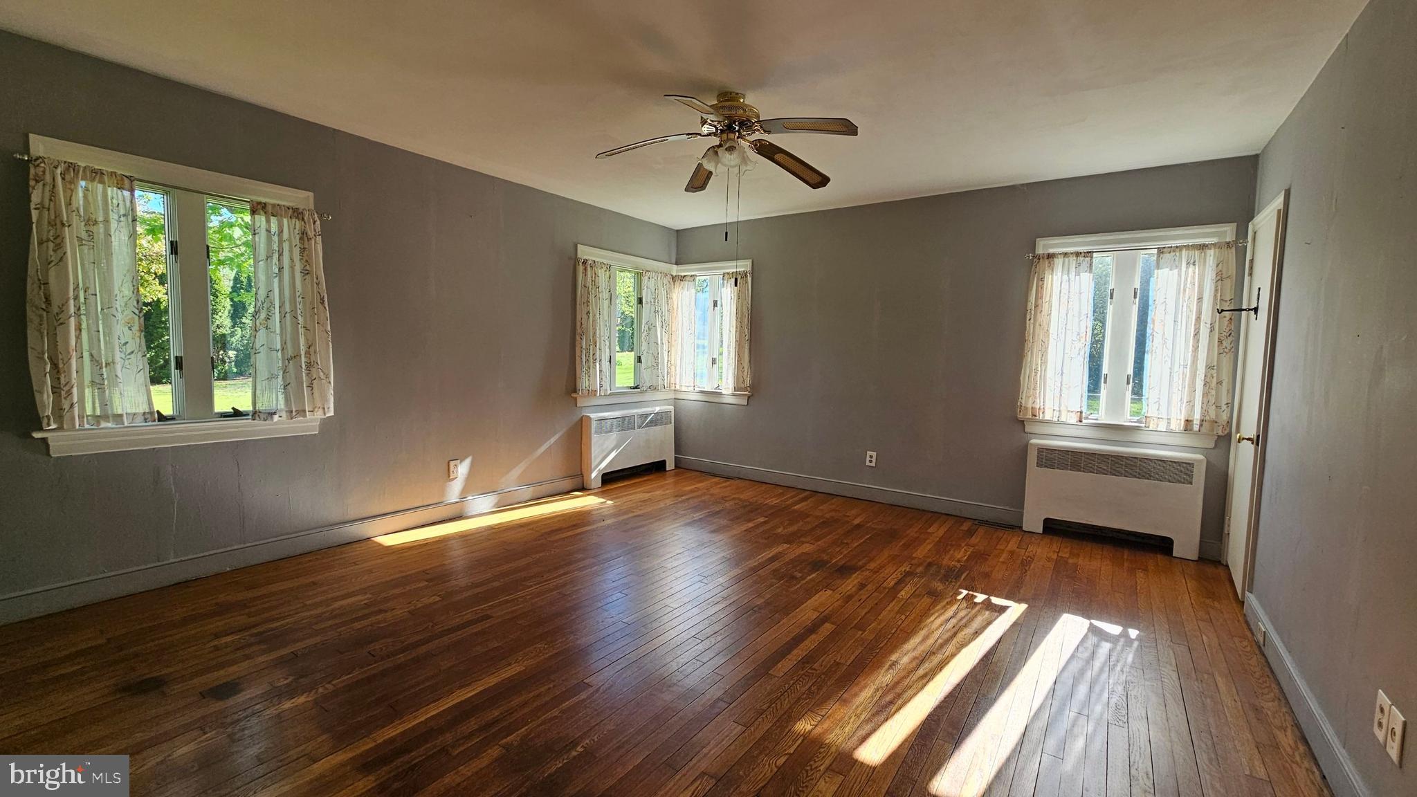 116 Beebe Run Road Bridgeton, NJ 08302 - Photo 17 of 24 wooden floor in an empty room with a window