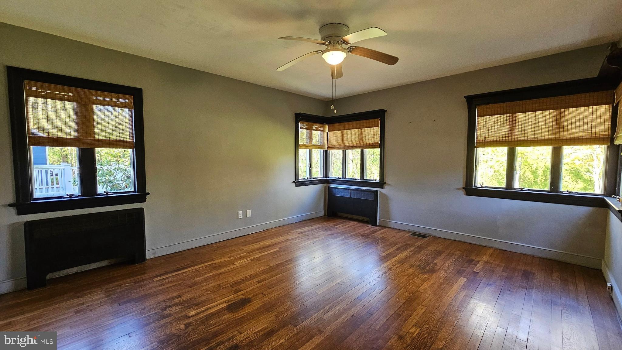116 Beebe Run Road Bridgeton, NJ 08302 - Photo 20 of 24 a view of an empty room with a window and wooden floor