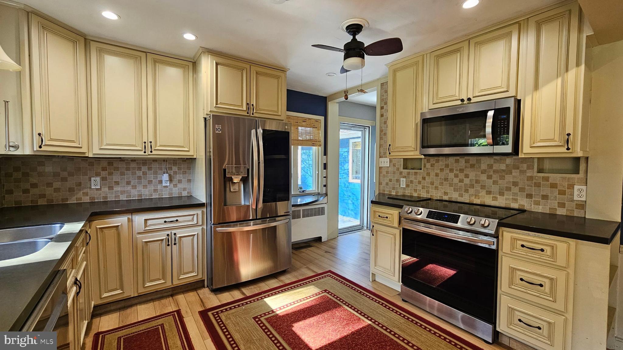 116 Beebe Run Road Bridgeton, NJ 08302 - Photo 6 of 24 a kitchen with stainless steel appliances granite countertop a stove a refrigerator and a microwave
