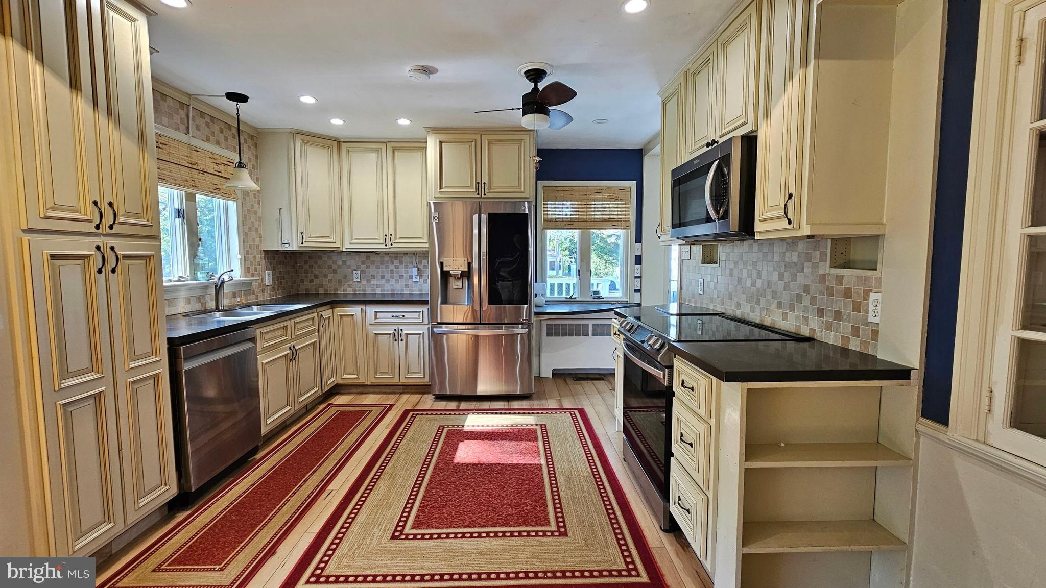 116 Beebe Run Road Bridgeton, NJ 08302 - Photo 8 of 24 a kitchen with stainless steel appliances granite countertop a refrigerator and a stove