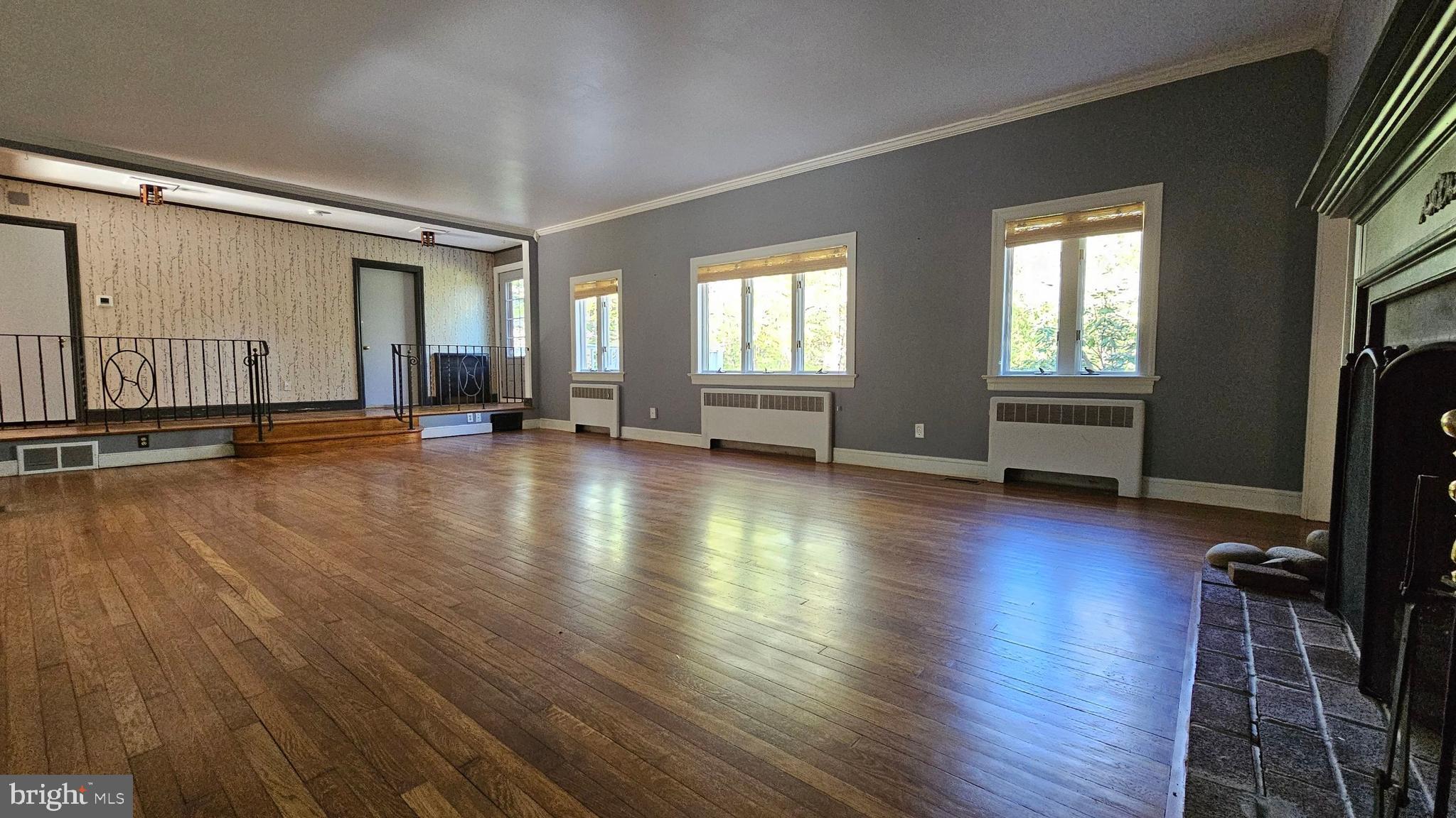 116 Beebe Run Road Bridgeton, NJ 08302 - Photo 10 of 24 an empty room with wooden floor and windows