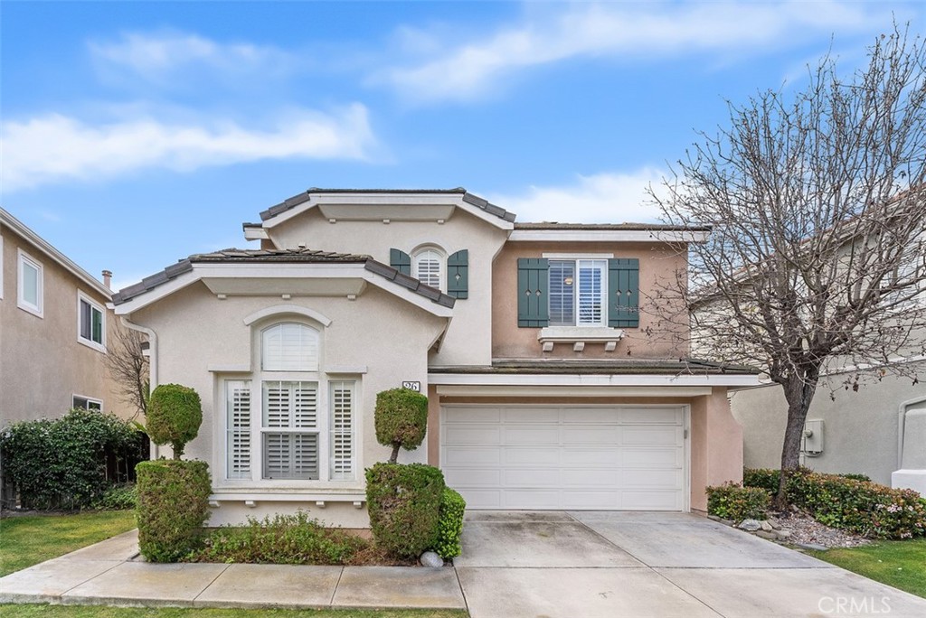 26 Richemont Way Aliso Viejo, CA 92656 - Photo 2 of 33 a front view of white house with a yard