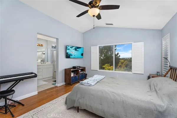 a bed room with a bed and a chandelier