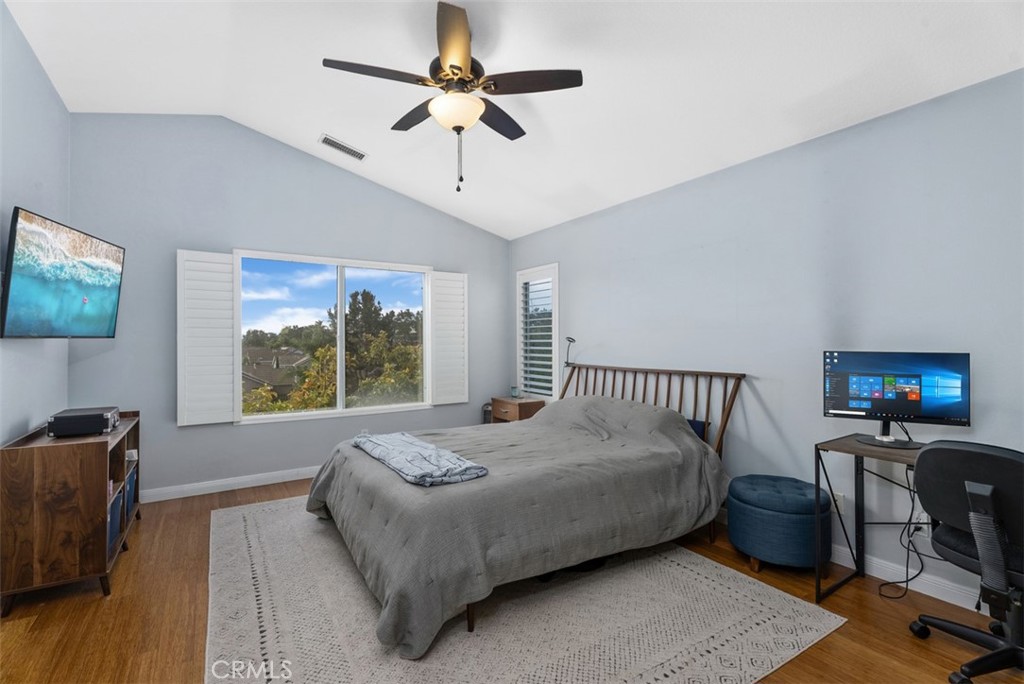 26 Richemont Way Aliso Viejo, CA 92656 - Photo 22 of 33 a bed room with a bed and a chandelier