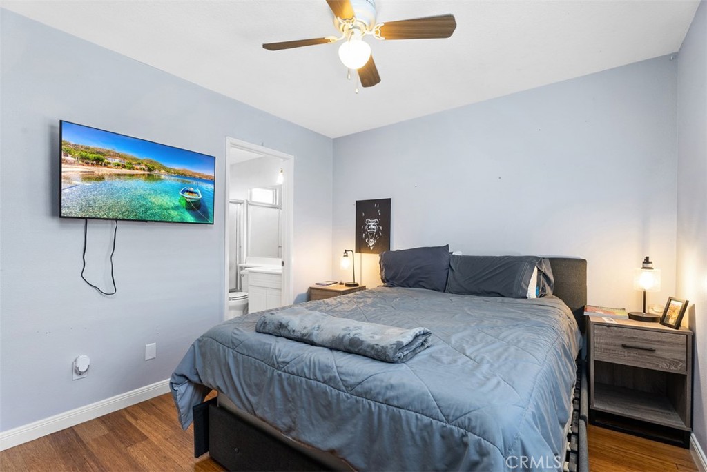 26 Richemont Way Aliso Viejo, CA 92656 - Photo 28 of 33 a bedroom with a bed and a chandelier