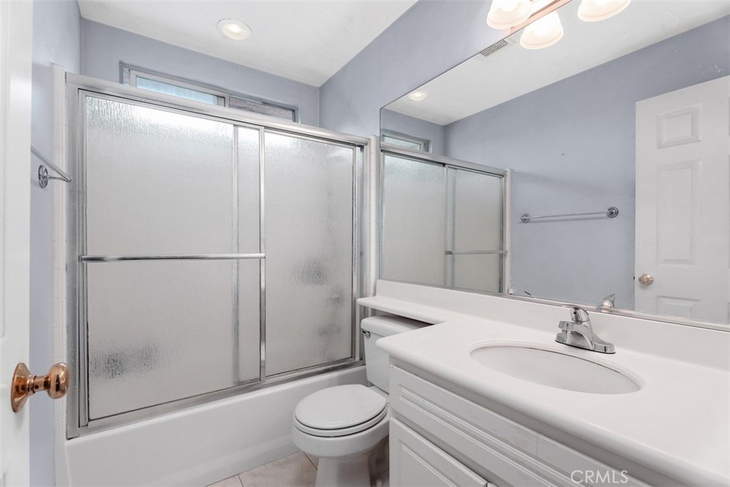 26 Richemont Way Aliso Viejo, CA 92656 - Photo 29 of 33 a bathroom with a sink toilet and shower