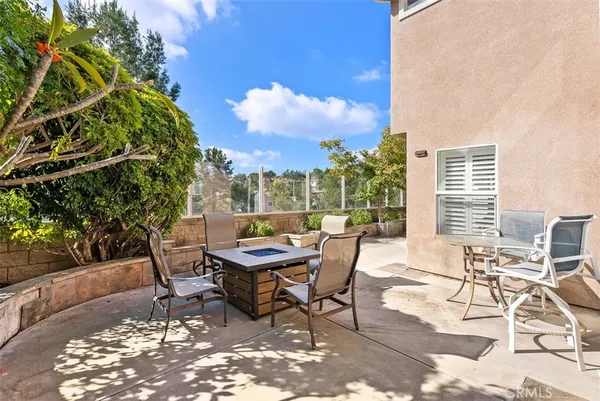 a view of a backyard with sitting area