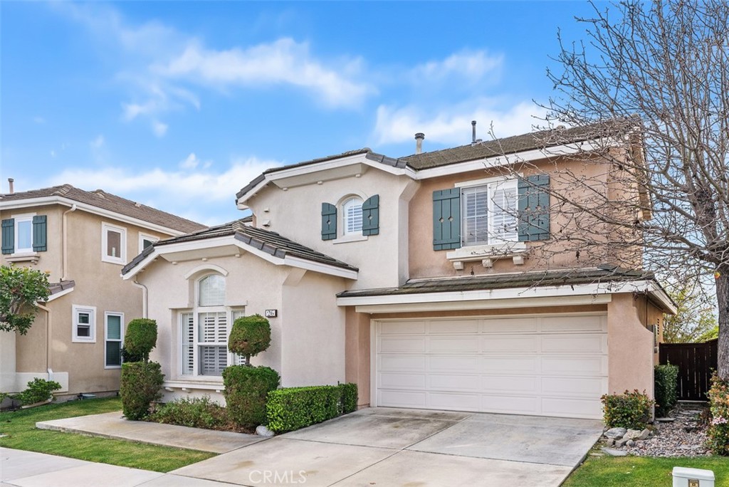 26 Richemont Way Aliso Viejo, CA 92656 - Photo 3 of 33 a front view of a house with a yard