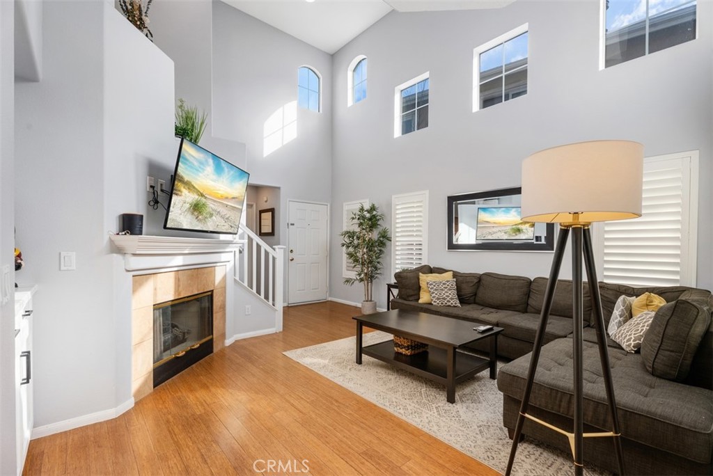 26 Richemont Way Aliso Viejo, CA 92656 - Photo 8 of 33 a living room with furniture and a fireplace