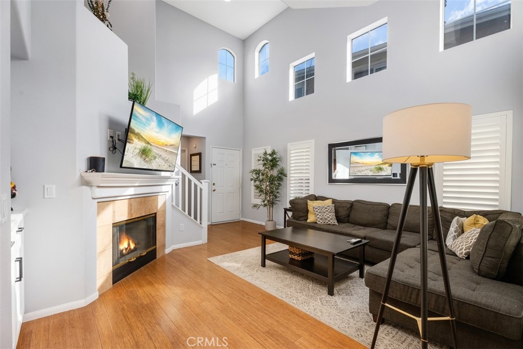 26 Richemont Way Aliso Viejo, CA 92656 - Photo 9 of 33 a living room with furniture and a fireplace