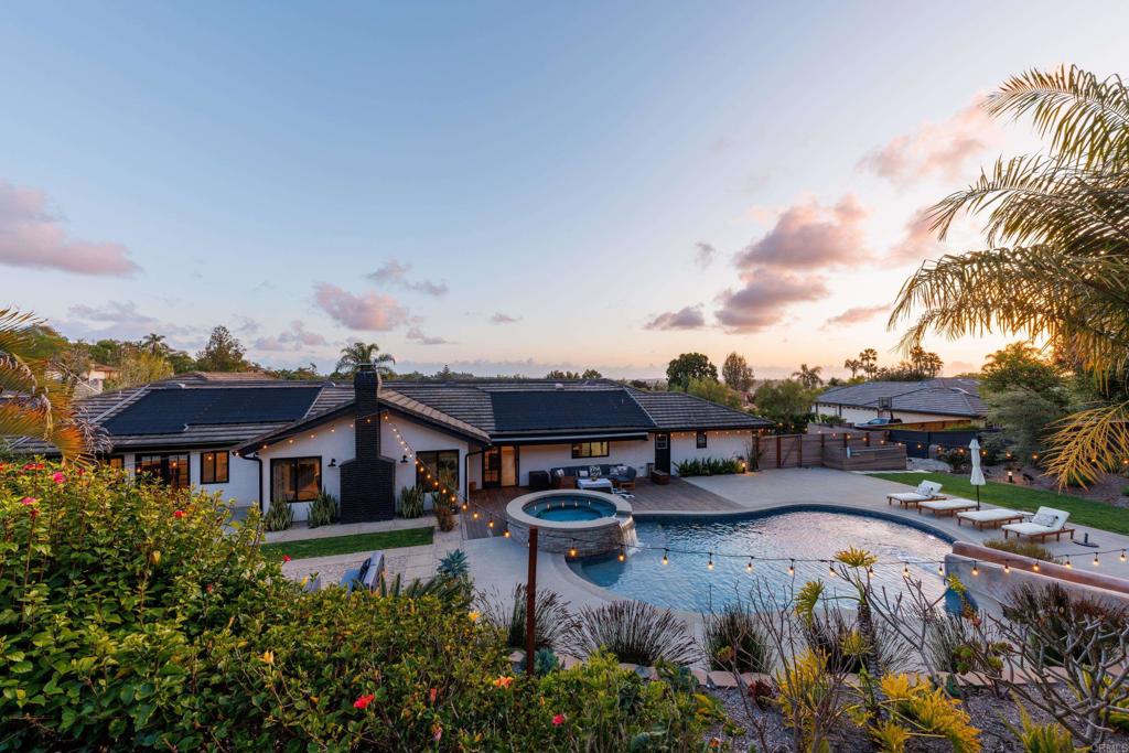 1637 Kings Way Vista, CA 92084 - Photo 1 of 39 a front view of a house with garden water fountain and outdoor seating