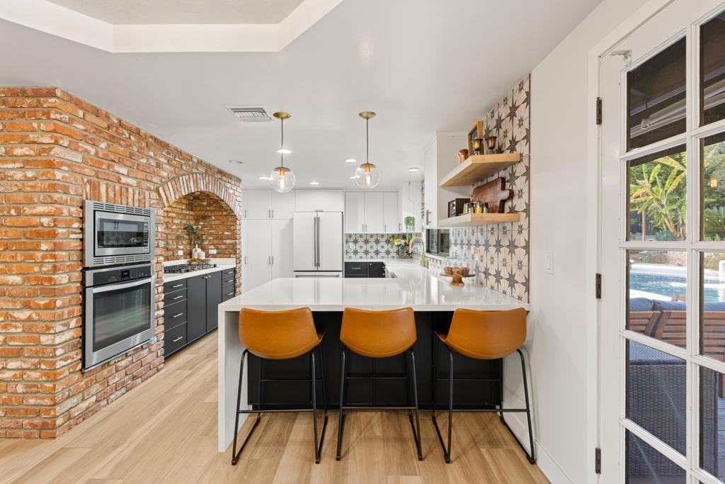 1637 Kings Way Vista, CA 92084 - Photo 12 of 39 a dining room with furniture and wooden floor