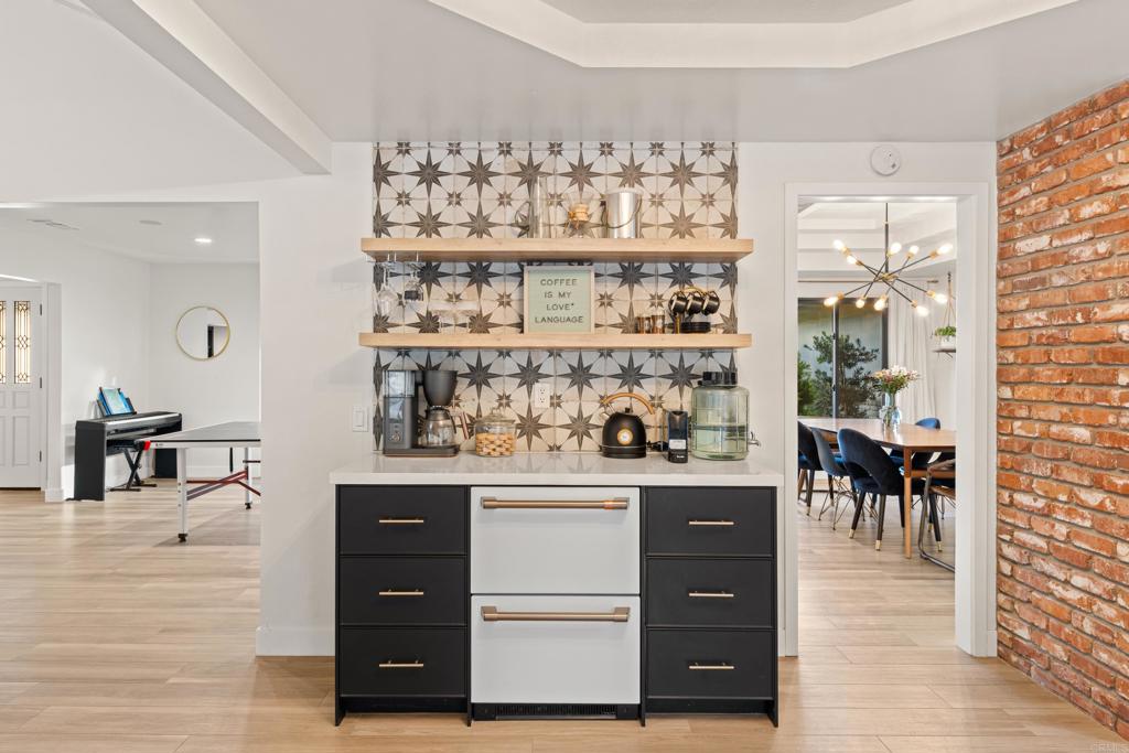 1637 Kings Way Vista, CA 92084 - Photo 13 of 39 a view of dining room with wooden floor and shelf