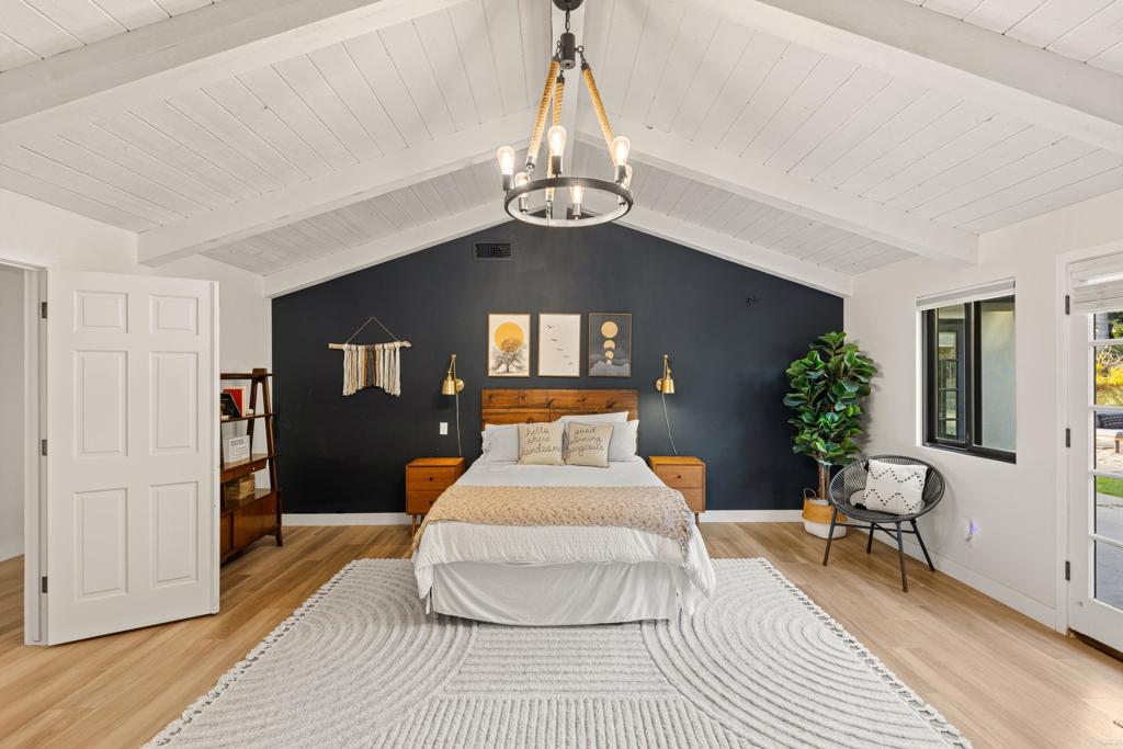 1637 Kings Way Vista, CA 92084 - Photo 17 of 39 a living room with furniture and a chandelier