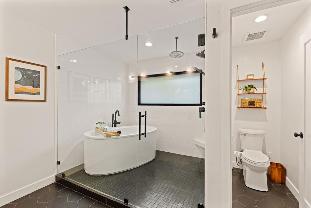 1637 Kings Way Vista, CA 92084 - Photo 18 of 39 a bathroom with a sink toilet and shower