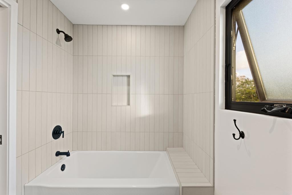 1637 Kings Way Vista, CA 92084 - Photo 22 of 39 a bathroom with a bathtub