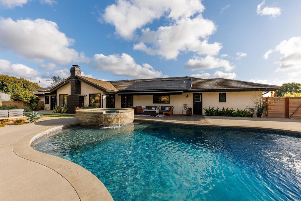 1637 Kings Way Vista, CA 92084 - Photo 25 of 39 a front view of a house with yard and green space