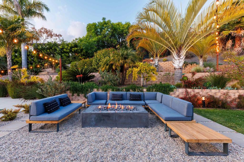1637 Kings Way Vista, CA 92084 - Photo 29 of 39 a view of a backyard with couches and a fire pit