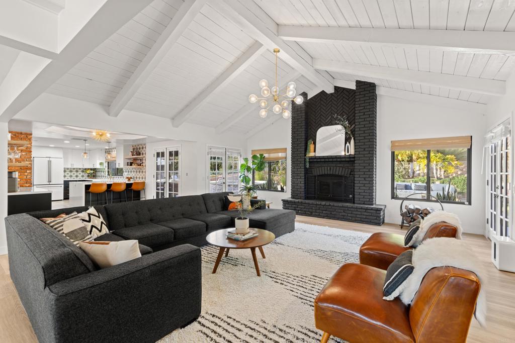 1637 Kings Way Vista, CA 92084 - Photo 8 of 39 a living room with furniture and a fireplace