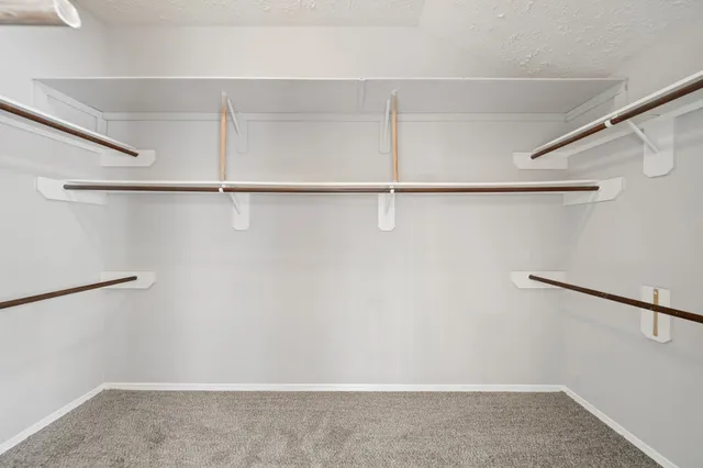 a white bath tub sitting next to a window