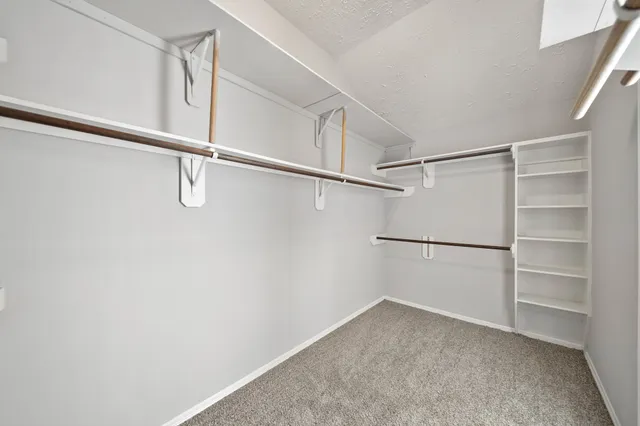 a view of an empty walk in closet