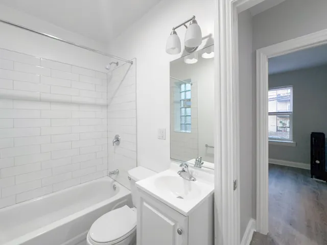 a bathroom with a toilet a sink and a bathtub