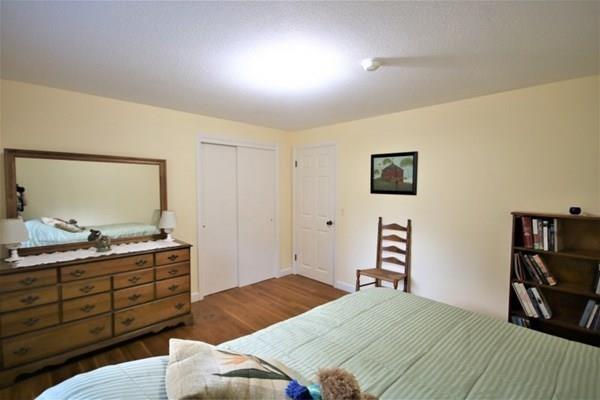 140 Old County Road Lancaster, MA 01523 - Photo 17 of 39 a bedroom with a bed and a television