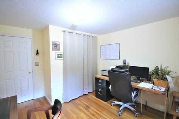 140 Old County Road Lancaster, MA 01523 - Photo 19 of 39 a view of a workspace with furniture and wooden floor