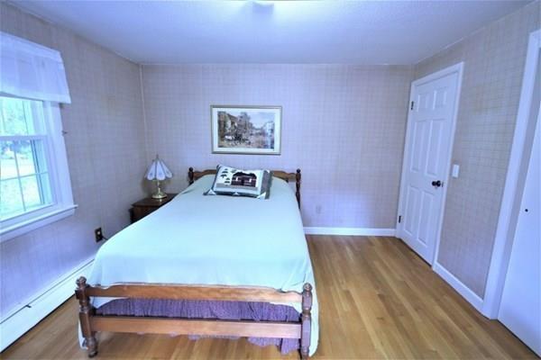 140 Old County Road Lancaster, MA 01523 - Photo 23 of 39 a bedroom with a bed and a dresser