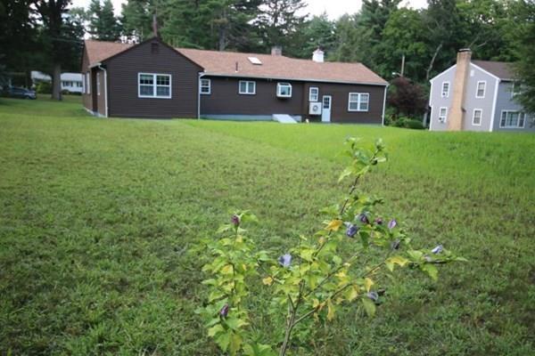 140 Old County Road Lancaster, MA 01523 - Photo 36 of 39 a view of a house with a yard and large trees
