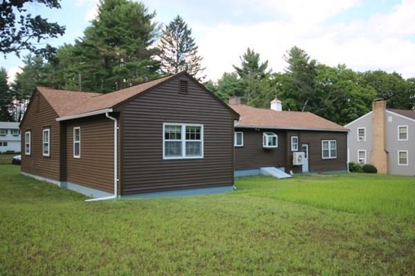 140 Old County Road Lancaster, MA 01523 - Photo 37 of 39 a front view of a house with a garden
