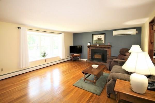 140 Old County Road Lancaster, MA 01523 - Photo 8 of 39 a living room with furniture and a fireplace