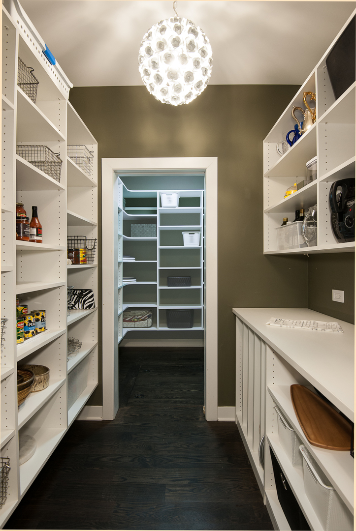 Undisclosed Address Riverwoods, IL 60015 - Photo 14 of 33 a view of a storage & utility room with washer and dryer