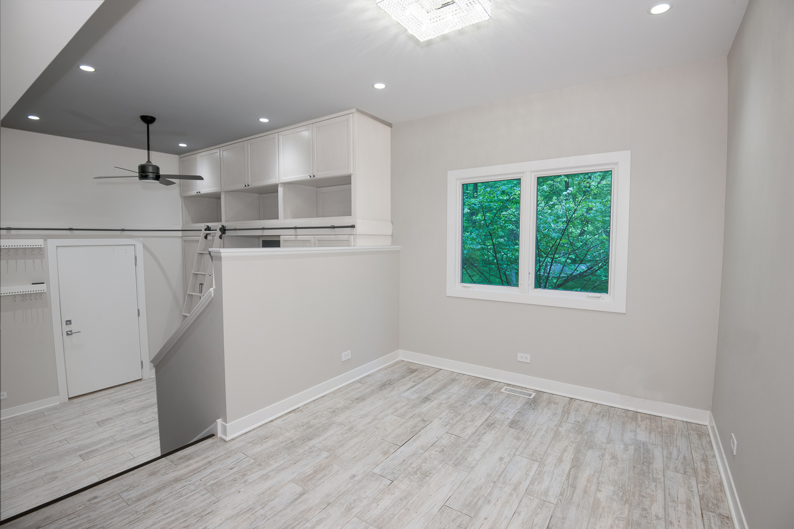 Undisclosed Address Riverwoods, IL 60015 - Photo 18 of 33 an empty room with wooden floor and a window