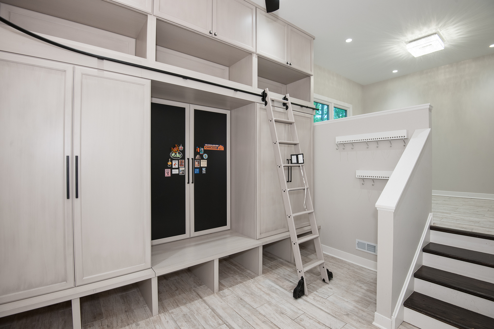 Undisclosed Address Riverwoods, IL 60015 - Photo 19 of 33 a view of a hallway with wooden floor and staircase